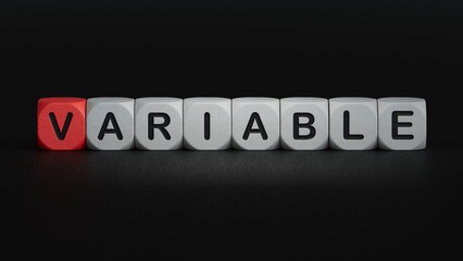 The word variable is written on wooden cubes.close up of wooden elements,Business Concept.3D rendering on black background.