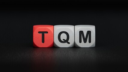 TQM, TEXT on wood cubes.close up of wooden elements,Business Concept.3D rendering on black background.