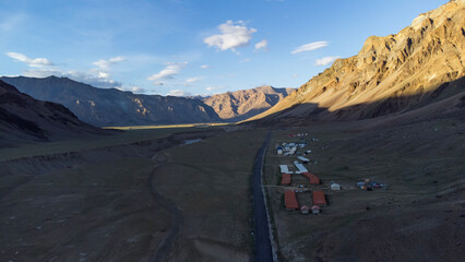 An aerial view of beautiful himalayan mountains in the evening at sarchu with tsarap river, keylong-leh road lahul, himachal pradesh, India.