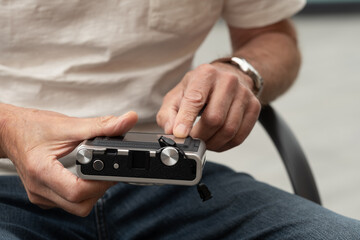 close up of a person holding a camera