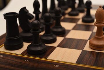Black and white chess. Wooden chess on a board. A chess game.