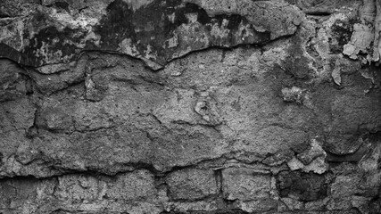 gray brick wall of an old building close up