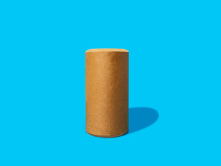 cylindrical wooden savings box container isolated on blue background
