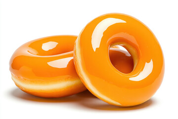 This image features a close-up of orange-glazed donuts showcasing a shiny finish, perfect for food-related content or dessert inspiration.