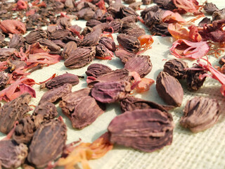 Variety of spices on bay leaf, ingredients for garam masala with Indian Chef statue, indian spice mix