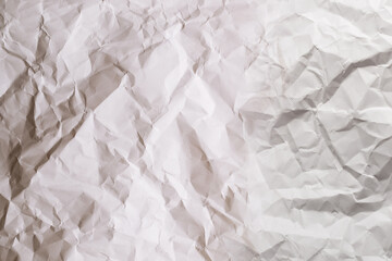 Crumpled white paper background.