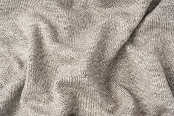 Grey wool sweater texture as a background.