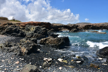 natural bridge, bridge, black sand beach, beach, black, waves, ocean, sea, aruba, remote, tranquil, solitude, lavarock, lava rock, rock, seascape, landscape, shore, shoreline, coast, coastal, 
