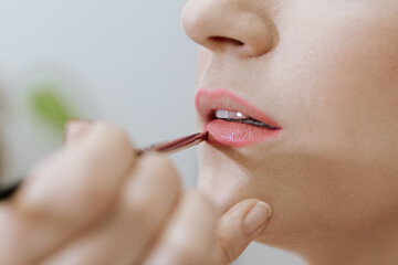 woman applying lipstick