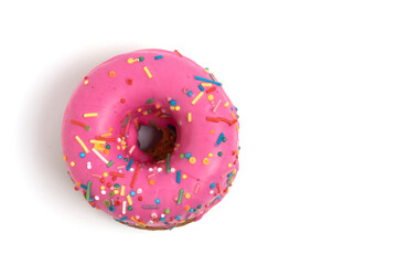 Pink donut with sprinkles isolated on white background. Top view.