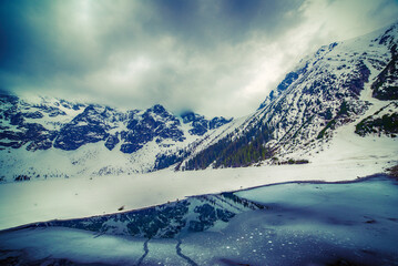 Frozen Lake Morskie Oko or Sea Eye Lake in Poland at Winter. © Roxana