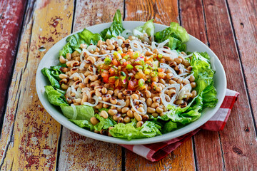 black eye pea salad served on a bed of lettuce