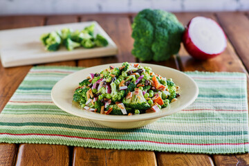 fresh broccoli salad served in a white bowl