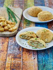 chicken and cream cheese stuffed pizza dough packs served on a white plate