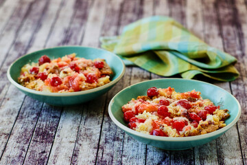 cherry dump cake served in a green bowls