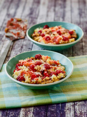 cherry dump cake served in a green bowls