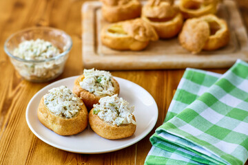 chicken salad puffs on a green napkin