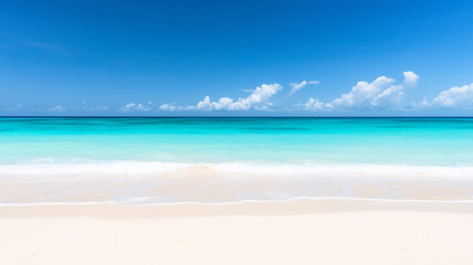 Obraz premium Tropical beach and turquoise sea with tide coming in as waves gently roll onto white sand 