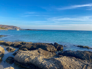 The rocky shore of the island washed by the sea
