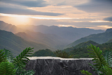 Stone granite table top podium outdoors with mountains sky at sunrise nature landscape background.rock placement pedestal present stand display tropical green forest concept.