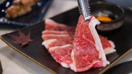 Premium marbled luxury sliced wagyu beef meat for yakiniku grilled steak sukiyaki