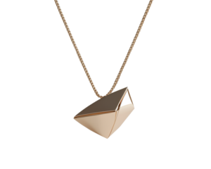 Elegant geometric pendant necklace on a delicate chain, isolated on white background.
