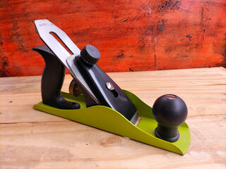 hand plane on wood background