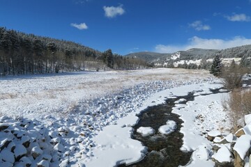 Snow covered rivers in the Rocky Mountains in winter, Peak to peak highway, Colorado