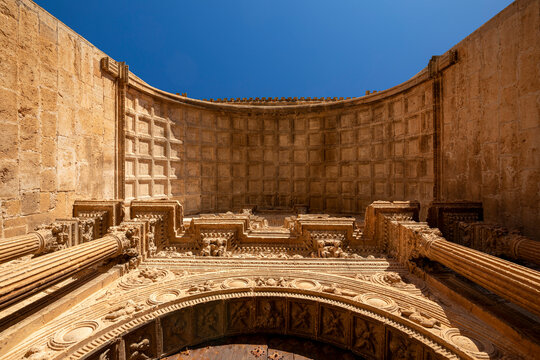 View from below of the Renaissance entrance to the church of Santa Mar&iacute;a in Alarc&oacute;n, Cuenca, Castilla-La Mancha, Spain, with golden morning light