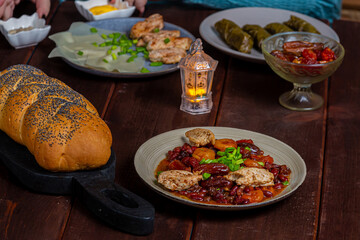 beans stewed with meat khinkali homemade and dolma homemade and sauce and hummus
