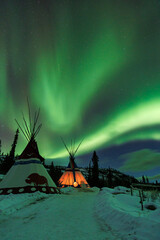 Tent at night with the northern lights. Yukon, Canada. © Esteban Dupinet