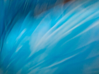 Vibrant blue patterns create dynamic motion effect