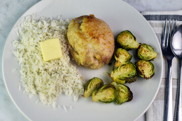 boneless pork chop  on rice with  roasted brussel sprouts