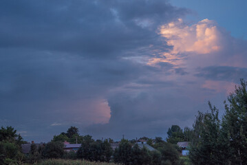 Obraz premium storm clouds over the sky in the village of Tuchyn