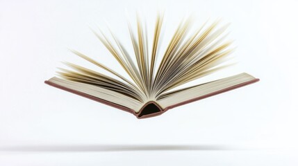 An open book floating in mid-air, great for imaginative or educational concepts