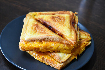 Grilled cheese sandwich on a plate. 
