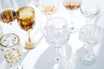 A collection of wine glasses placed on a table, great for food and drink related images or scenes