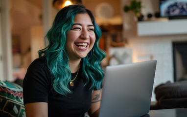 Happy young woman working remotely on a virtual video team meeting call, remote work & flexible culture concept. Inclusive & diverse dei workplace, blasian latina businesswoman, green hair,  laptop
