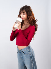 Enjoying a Warm Beverage in a Cozy Setting While Dressed in Stylish Casual Attire