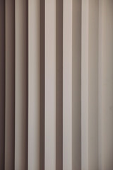 Obraz premium Wall decor. Design concept. Beige vertical stripes background, modern pattern style. Backgrounds and textures.