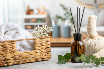 Aromatic reed air freshener on wooden table.Diffuser with natural fruity, floral, spicy aroma.interior scent. Luxury perfume for the home.Orange, lime, coffee, cinnamon, star anise, vanilla and orchid