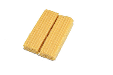 layers of wafer biscuits filled with creamy vanilla, a wafer is a crisp, sweet, very thin, flat, light biscuit,  creamy vanilla sandwiched in wafers, treat time biscuit, selective focus