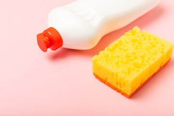 Colorful dish sponges on textured background. Kitchen sponge. Cleaning concept, cleaning service. Dishwashing liquid with clean and dirty dishes plate. Place for text, copy space. Wash the dishes.