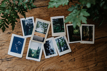 vintage polaroid photos spread on wooden table