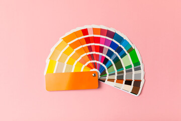 Color palette on a bright colored background. Color palette guide. paper catalog of rainbow color....