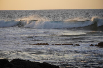 Autumn afternoon watching the sunset and waves from the cliff