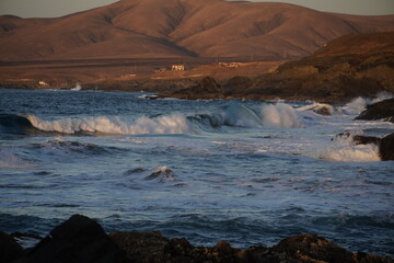 Autumn afternoon watching the sunset and waves from the cliff