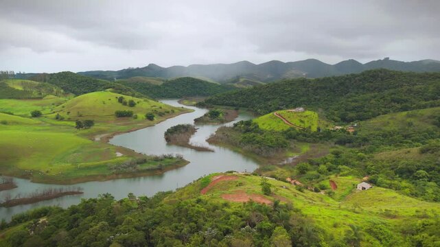 aerial view of the countryside of Sao Paulo state in Brazil with views of river and mountains and a few clouds