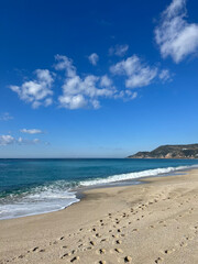 Beach waves footprints. High quality photo