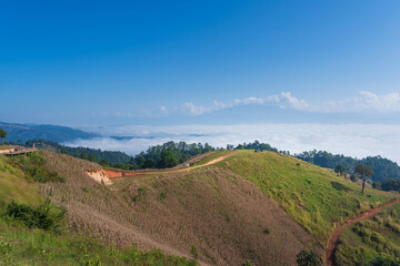 Beautiful natural scenery of cloudscape the sea of mist in the morning at Doi Ba Lu Kho Mountain View Point Campground at Mae Chaem, Chiang Mai, Thailand. Background Happy holiday recreation.